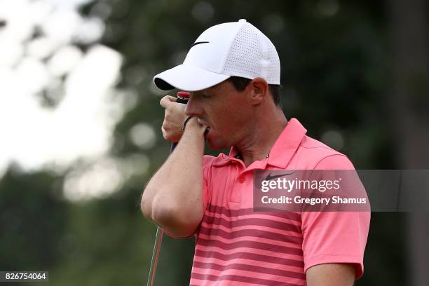 Rory McIlroy of Northern Ireland reacts to a missed birdie putt on the 14th green during the third round of the World Golf Championships -...