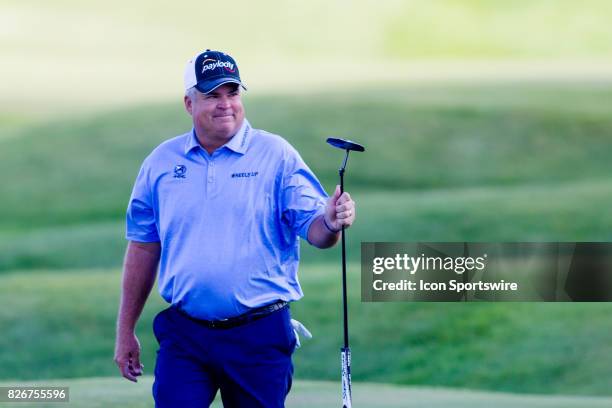 Kenny Perry acknowledges the crowd while walking to the 18th green during the First Round of the 3M Championship at TPC Twin Cities on August 8, 2017...