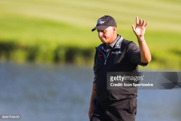 Rocco Mediate waves to the crowd while walking to the 18th green during the First Round of the 3M Championship at TPC Twin Cities on August 8, 2017...