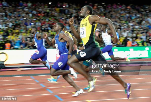 Justin Gatlin of the United States leads the Men's 100 metres final from Christian Coleman of the United States and Usain Bolt of Jamaica during day...