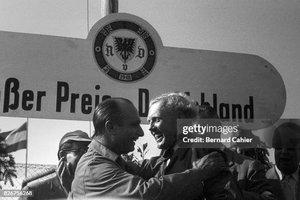 Juan Manuel Fangio-Mike Hawthorn, Grand Prix of Germany, Nurburgring, 04 August 1957. Podium, with winner Juan Manuel Fangio and Mike Hawthorn.