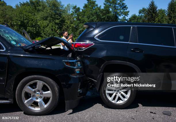 Two cars sit at a standstill after colliding July 30, 2017 along the New York State Thruway in Plattekill, New York. New York State Police and...