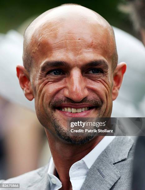 Peyman Amin, a presenter of the TV model casting show 'Germanys next Top Model', pictured on the course during the Friday's Race Day at Iffezheim...