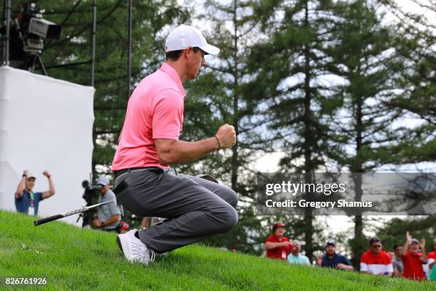 Rory McIlroy of Northern Ireland reacts to a chip in on the 12th green during the third round of the World Golf Championships - Bridgestone...