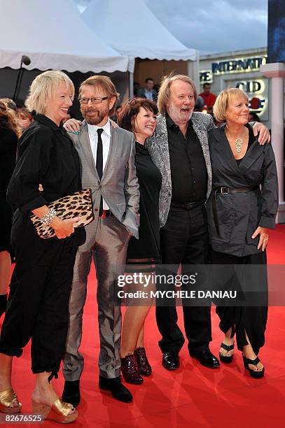 Bjorn Ulvaeus and Benny Anderson of the Swedish group Abba pose with British playwrier Catherine Johnson and producer Judy Cramer, upon arrival for...