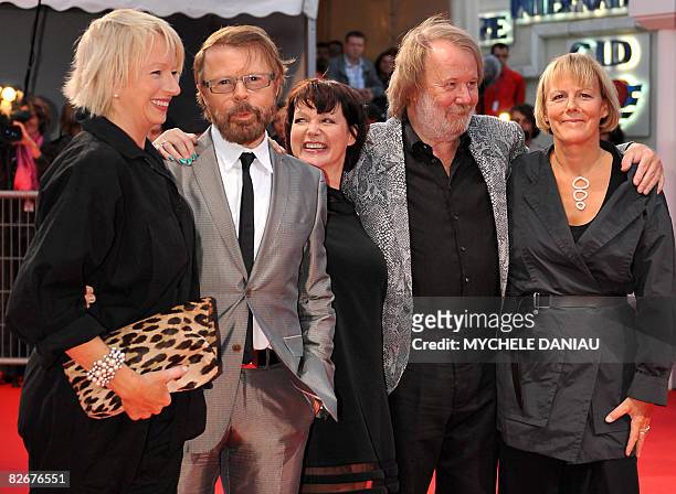 Bjorn Ulvaeus and Benny Anderson of the Swedish group Abba pose with British playwrier Catherine Johnson and producer Judy Cramer, upon arrival for...
