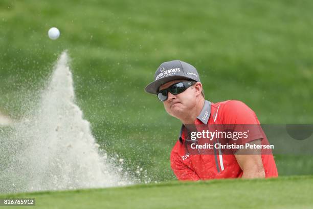 Brian Gay plays his shot out of the bunker on the fifth hole during the third round of the Barracuda Championship at Montreux Country Club on August...