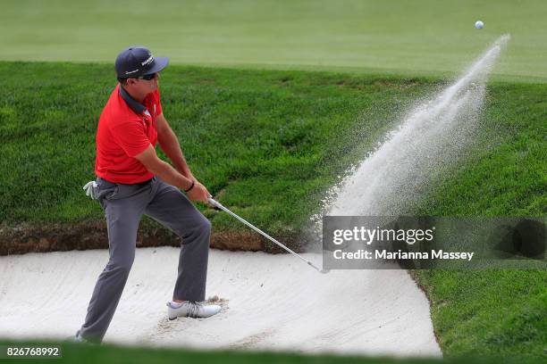 Brian Gay plays his shot out of the bunker on the fifth hole during the third round of the Barracuda Championship at Montreux Country Club on August...