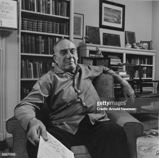 American city planner Robert Moses poses for portrait in his office as he holds a crossword puzzle, New York, New York, April 8, 1964.