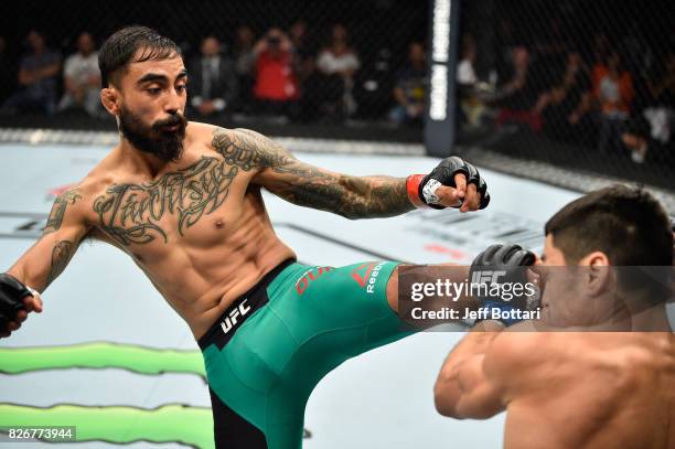 Jose Quinonez of Mexico kicks Diego Rivas of Chile in their bantamweight bout during the UFC Fight Night event at Arena Ciudad de Mexico on August 5,...