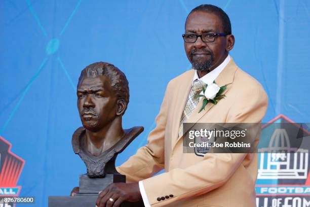 Kenny Easley poses with his bust during the Pro Football Hall of Fame Enshrinement Ceremony at Tom Benson Hall of Fame Stadium on August 5, 2017 in...