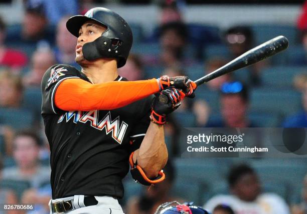 Giancarlo Stanton of the Miami Marlins hits a sixth inning solo home run against the Atlanta Braves at SunTrust Park on August 5, 2017 in Atlanta,...