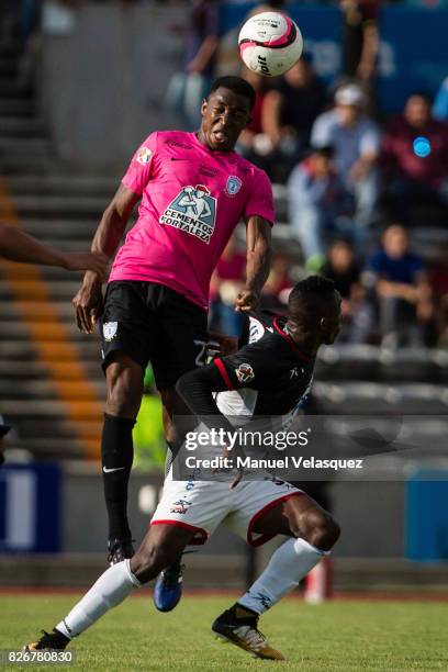 Oscar Murillo of Pachuca goes for a header with Julian Quinones of Lobos BUAP during the third round match between Lobos BUAP and Pachuca as part of...