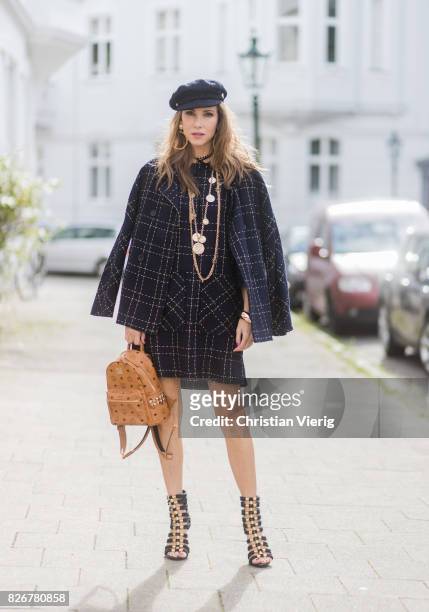 Model and fashion blogger Alexandra Lapp wearing tweed dress and coat from Steffen Schraut, Balmain x HM sandals, Strak backpack by MCM, Chanel tweed...