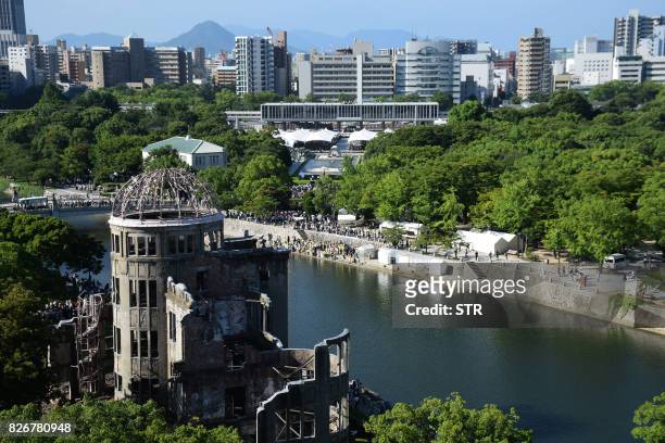 This overhead view shows the Hiroshima Atomic Bomb dome and Peace Memorial Park as people attend the 72nd anniversary memorial service for the atomic...