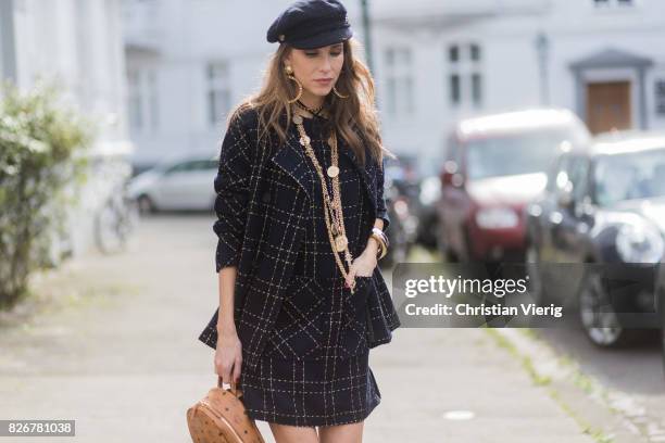 Model and fashion blogger Alexandra Lapp wearing tweed dress and coat from Steffen Schraut, Balmain x HM sandals, Strak backpack by MCM, Chanel tweed...