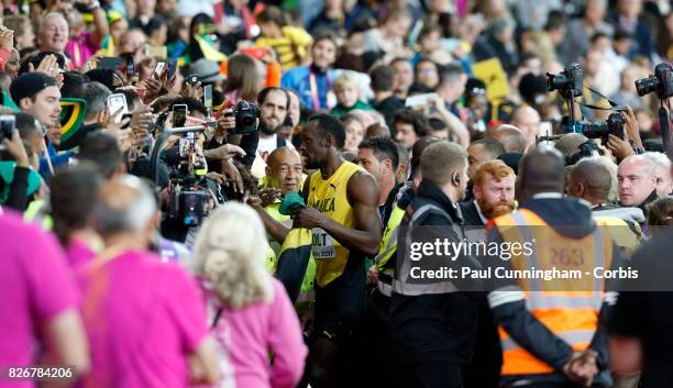 Usain Bolt having run his last 100m race enjoys the attention of fans while surround by photographers during day two of the 16th IAAF World Athletics...