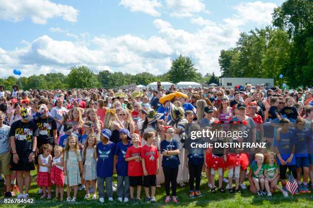 Sets of twins and multiples wait for the group photo to be taken on August 5 during the Twins Days Festival in Twinsburg, Ohio, on August 5, 2017. -...