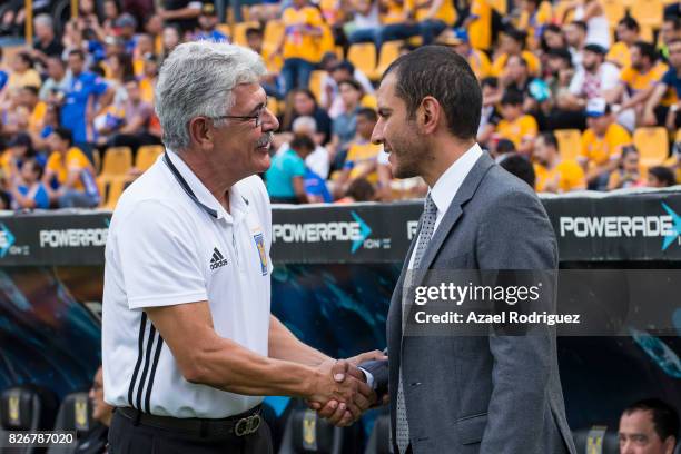 Ricardo 'Tuca' Ferretti, coach of Tigres, shakes hands with Jaime Lozano, coach of Queretaro, prior to the 3rd round match between Tigres UANL and...