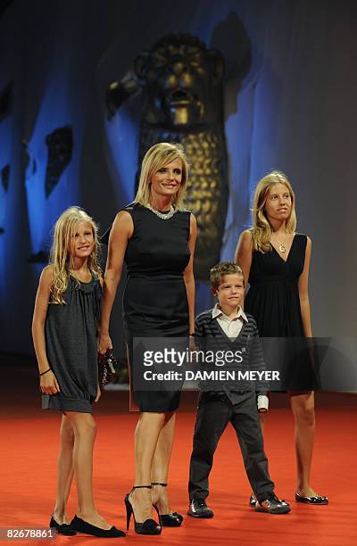 Italy's actress Isabella Ferrari and her children Nina, Giovanni and Teresa pose before the screening of the movie "Il Seme della Discordia" directed...