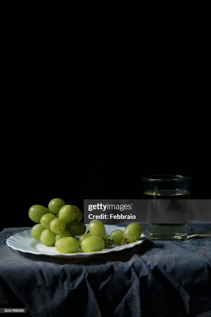 Still life of grapes and glass of wine