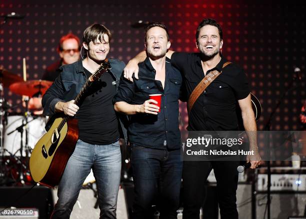 Chris Carmack, Will Chase and Charles Esten perform during the Concert for the CMT Series "Nashville" at Ford Amphitheater at Coney Island Boardwalk...