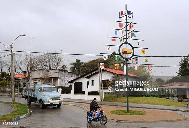 View of a metal tree displaying the Swiss, French and Uruguayan flags and the coat of arms of the many Swiss cantons on September 5, 2008 in Nueva...
