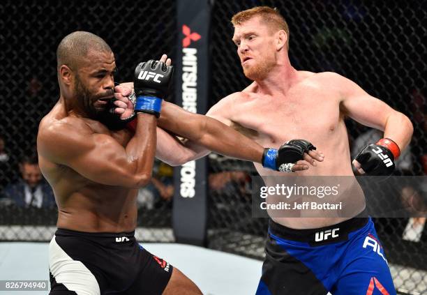 Sam Alvey punches Rashad Evans in their middleweight bout during the UFC Fight Night event at Arena Ciudad de Mexico on August 5, 2017 in Mexico...