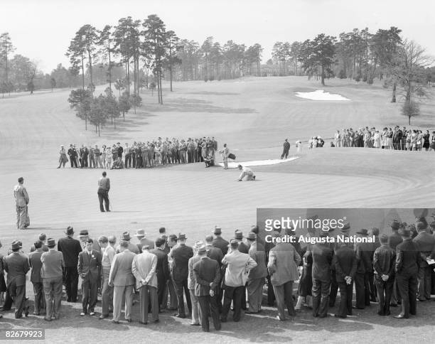 1930s: Bobby Jones and Jimmy Demaret putt on the 9th green during a 1930's Masters Tournament at Augusta National Golf Club in Augusta, Georgia.
