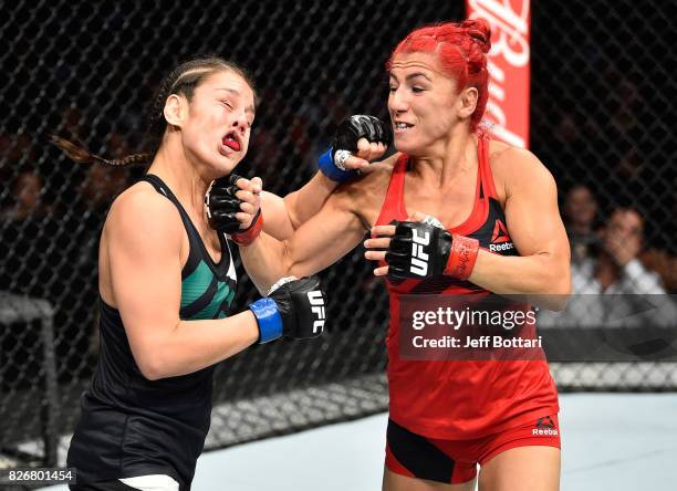 Randa Markos of Iraq punches Alexa Grasso of Mexico in their women's strawweight bout during the UFC Fight Night event at Arena Ciudad de Mexico on...