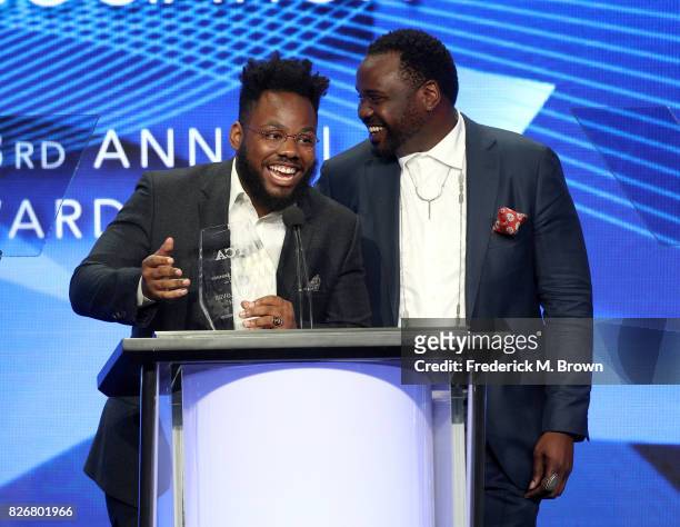 Writer Stephen Glover and actor Brian Tyree Henry accept the award for 'Individual Achievement in Comedy' for 'Atlanta' on behalf of Donald Glover...