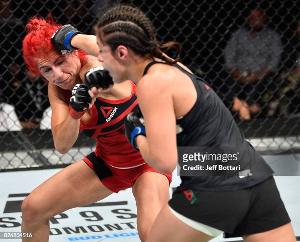 Alexa Grasso of Mexico punches Randa Markos of Iraq in their women's strawweight bout during the UFC Fight Night event at Arena Ciudad de Mexico on...