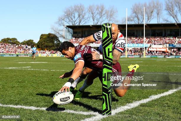 Matthew Wright of the Sea Eagles scores a try during the round 22 NRL match between the Manly Warringah Sea Eagles and the Sydney Roosters at...