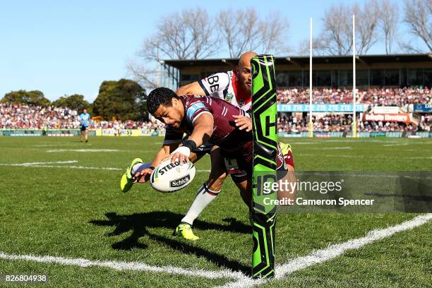 Matthew Wright of the Sea Eagles scores a try during the round 22 NRL match between the Manly Warringah Sea Eagles and the Sydney Roosters at...