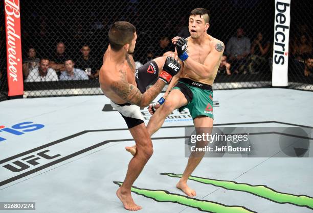 Sergio Pettis kicks Brandon Moreno of Mexico in their flyweight bout during the UFC Fight Night event at Arena Ciudad de Mexico on August 5, 2017 in...