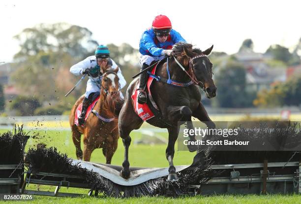 John Allen riding Ancient King wins race 5 the Grand National Hurdle during Grand National Hurdle Day at Sandown Lakeside on August 6, 2017 in...