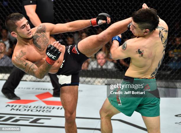 Sergio Pettis kicks Brandon Moreno of Mexico in their flyweight bout during the UFC Fight Night event at Arena Ciudad de Mexico on August 5, 2017 in...