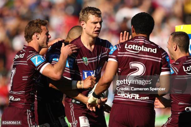 Tom Trbojevic of the Sea Eagles celebrates scoring a try during the round 22 NRL match between the Manly Warringah Sea Eagles and the Sydney Roosters...