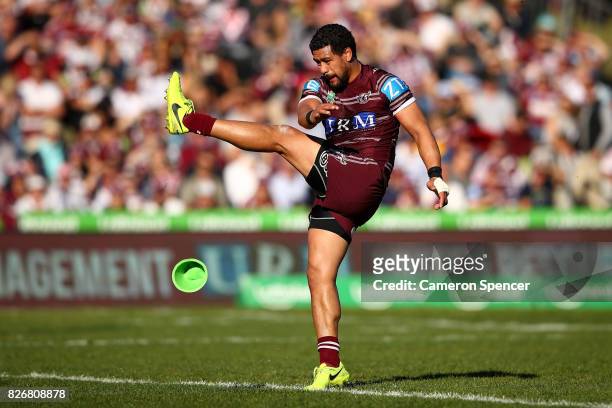 Matthew Wright of the Sea Eagles kicks a goal during the round 22 NRL match between the Manly Warringah Sea Eagles and the Sydney Roosters at...