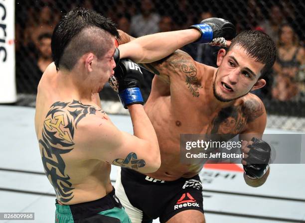 Sergio Pettis punches Brandon Moreno of Mexico in their flyweight bout during the UFC Fight Night event at Arena Ciudad de Mexico on August 5, 2017...