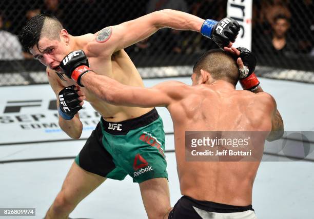 Sergio Pettis punches Brandon Moreno of Mexico in their flyweight bout during the UFC Fight Night event at Arena Ciudad de Mexico on August 5, 2017...