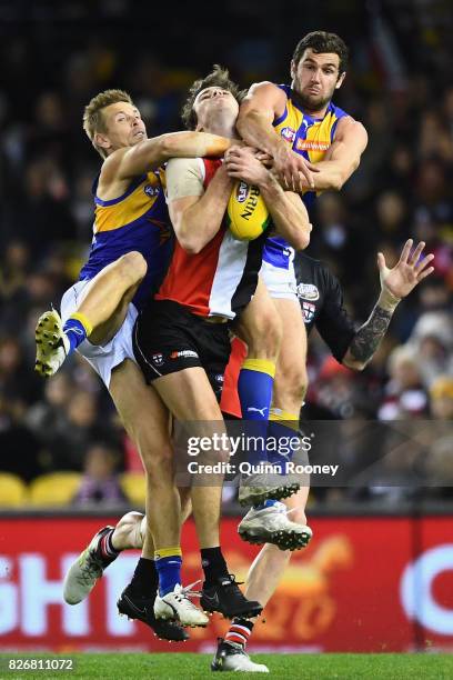 Dylan Roberton of the Saints marks infront of Mark LeCras and Jack Darling of the Eagles during the round 20 AFL match between the St Kilda Saints...