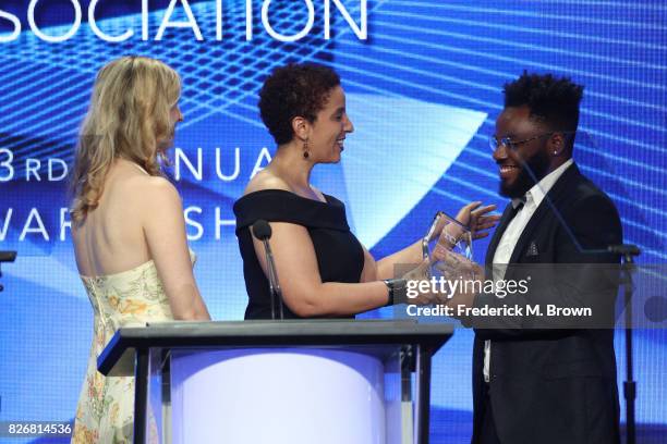 Collider's Allison Keene and TCA Treasurer/Salon's Melanie McFarland present the award for 'Outstanding Achievement in Comedy' for 'Atlanta' to...