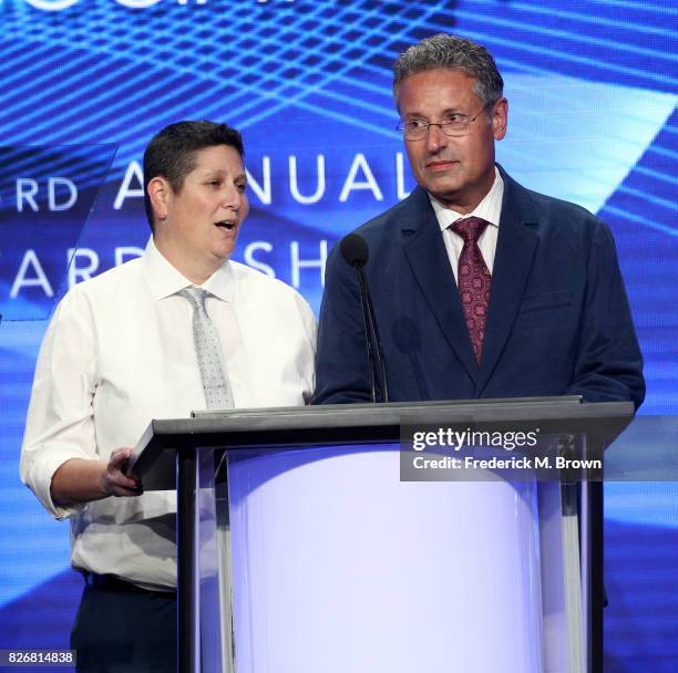 The Hollywood Reporter's Lesley Goldberg and USA Today's Robert Bianco present the award for 'Outstanding New Program' onstage at the 33rd Annual...