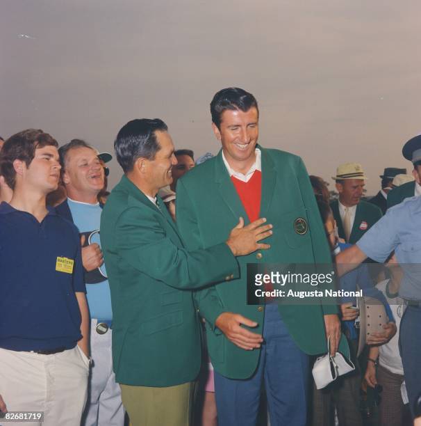 Bob Goalby, left, 1968 Masters Champion, helps 1969 Champion George Archer into his Green Jacket during the 1969 Masters Tournament Green Jacket...