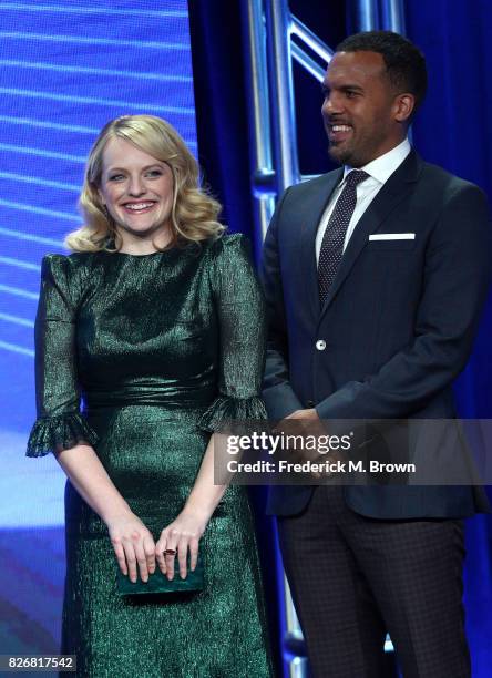 Actors Elisabeth Moss and O. T. Fagbenle accept the award for 'Program of the Year' for 'The Handmaid's Tale' onstage at the 33rd Annual Television...