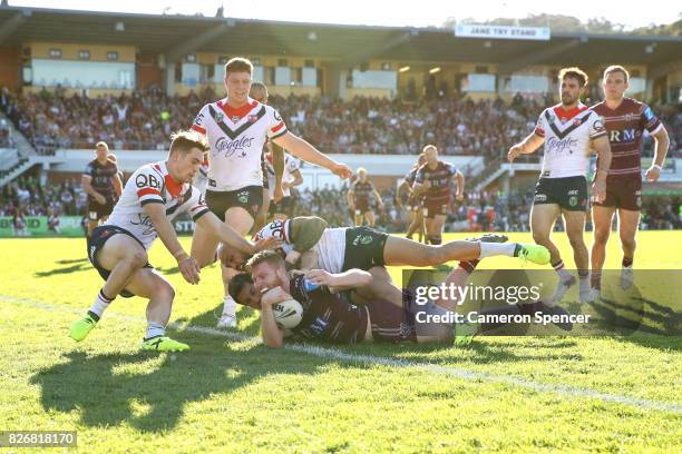 Bradley Parker of the Sea Eagles scores a try during the round 22 NRL match between the Manly Warringah Sea Eagles and the Sydney Roosters at...