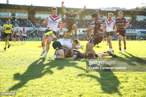 Bradley Parker of the Sea Eagles scores a try during the round 22 NRL match between the Manly Warringah Sea Eagles and the Sydney Roosters at...