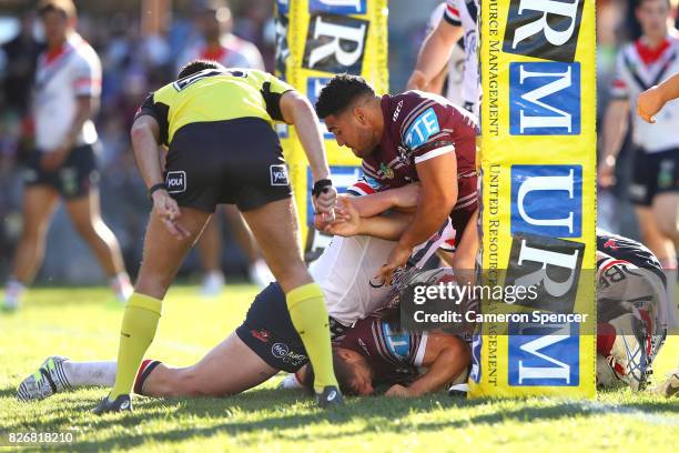 Lewis Brown of the Sea Eagles scores a try during the round 22 NRL match between the Manly Warringah Sea Eagles and the Sydney Roosters at Lottoland...