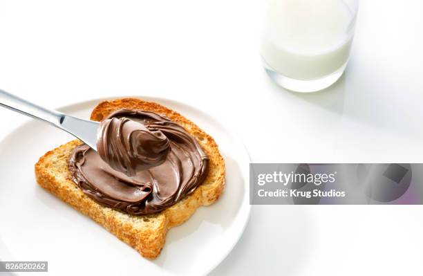 hazelnut chocolate spread - chocolate spread stock pictures, royalty-free photos & images